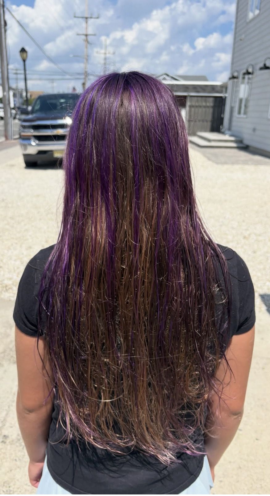 Long brunette hair with violet streaks