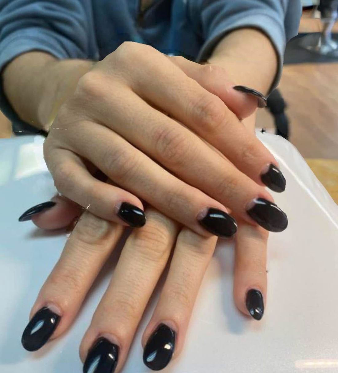 Glossy black almond nails